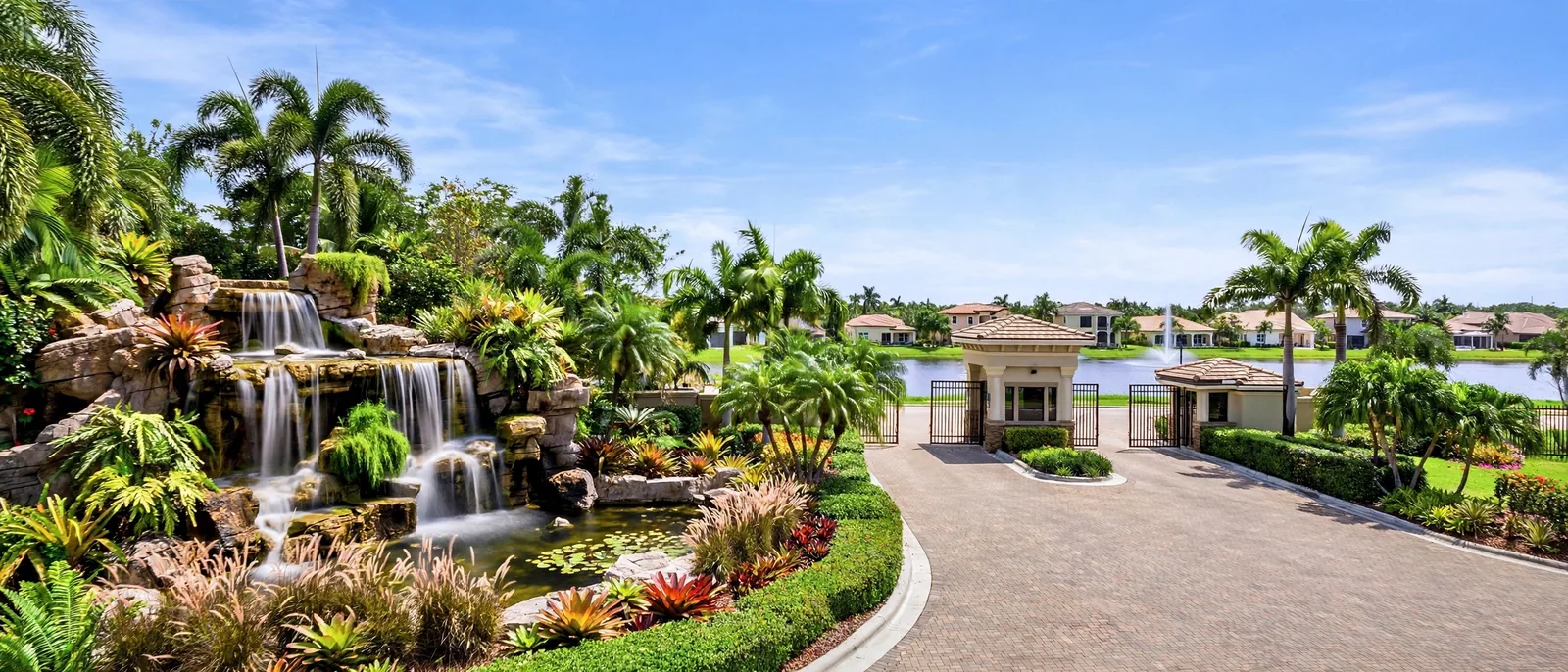 Waterfall entrance feature and homes in the gated Boca Falls community, Boca Raton